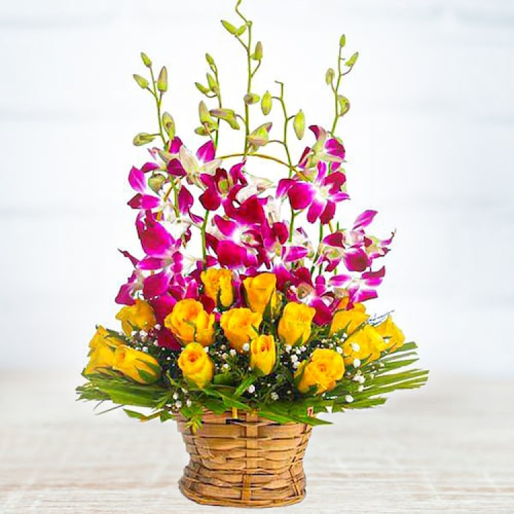 Perfect Basket Arragement Of Rochids And Yellow Roses